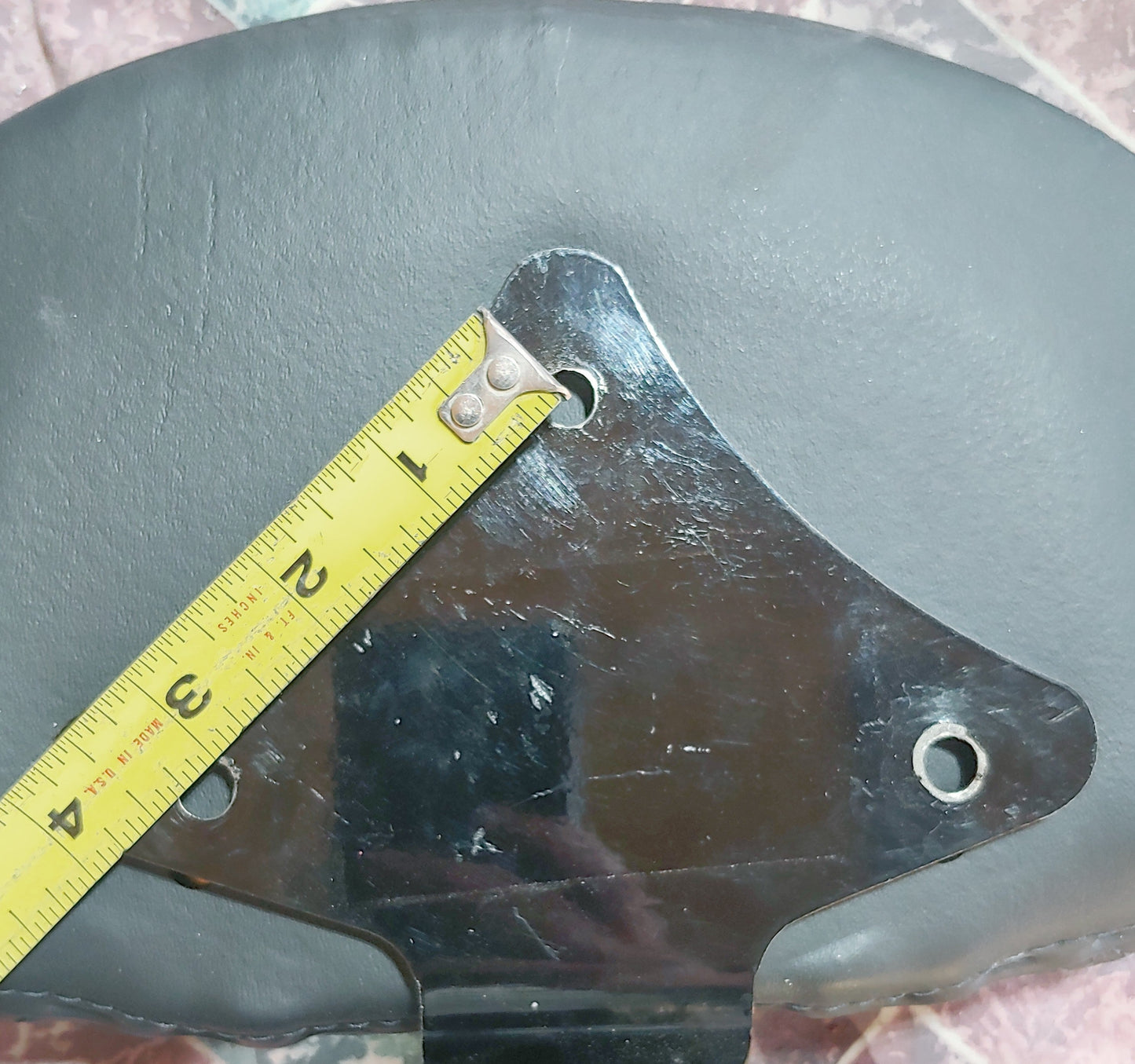 Custom Harley backrest plate with punisher stretching through