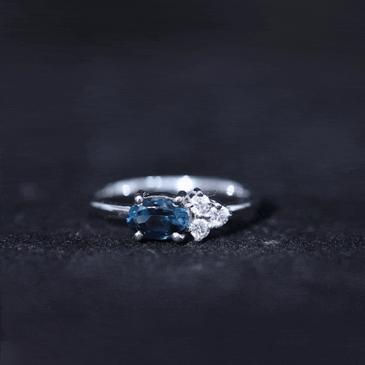 0.4 Carat Oval Cut London Blue Topaz East West Promise Ring with Diamond Trio