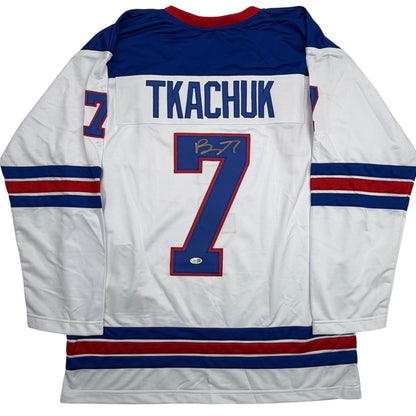 Autographed/Signed Brady Tkachuk USA United States 2026 Olympics Gold Medal White Hockey Jersey JSA COA