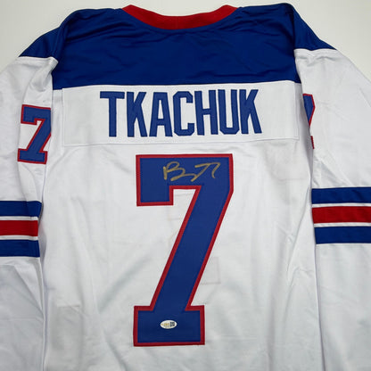 Autographed/Signed Brady Tkachuk USA United States 2026 Olympics Gold Medal White Hockey Jersey JSA COA