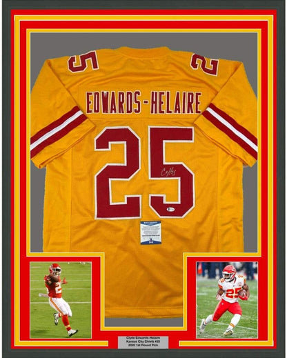 Framed Autographed/Signed Clyde Edwards-Helaire 35x39 Kansas City Yellow Football Jersey Beckett BAS COA