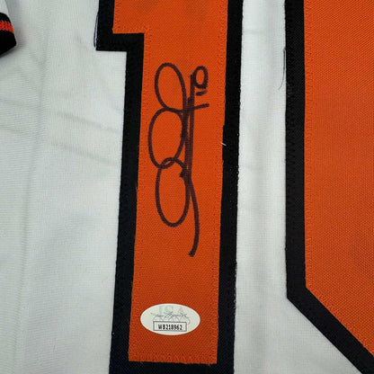 Framed Autographed/Signed Adam Jones 35x39 Baltimore White Baseball Jersey JSA COA