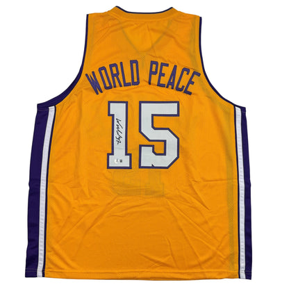 Autographed/Signed Ron Artest Metta World Peace Los Angeles Yellow Basketball Jersey Beckett BAS COA