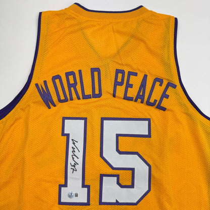 Autographed/Signed Ron Artest Metta World Peace Los Angeles Yellow Basketball Jersey Beckett BAS COA