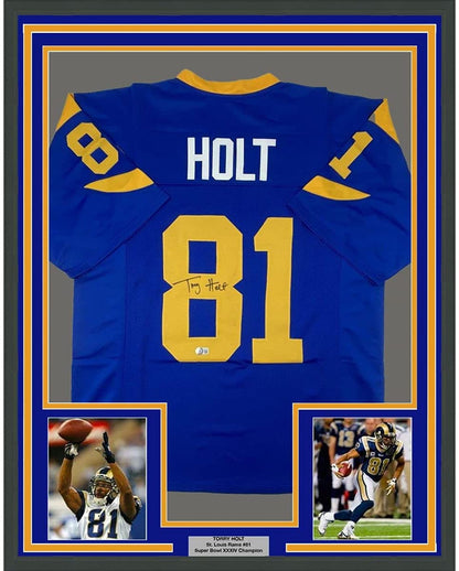 Framed Autographed/Signed Torry Holt 35x39 St. Louis Retro Blue Football Jersey Beckett BAS COA