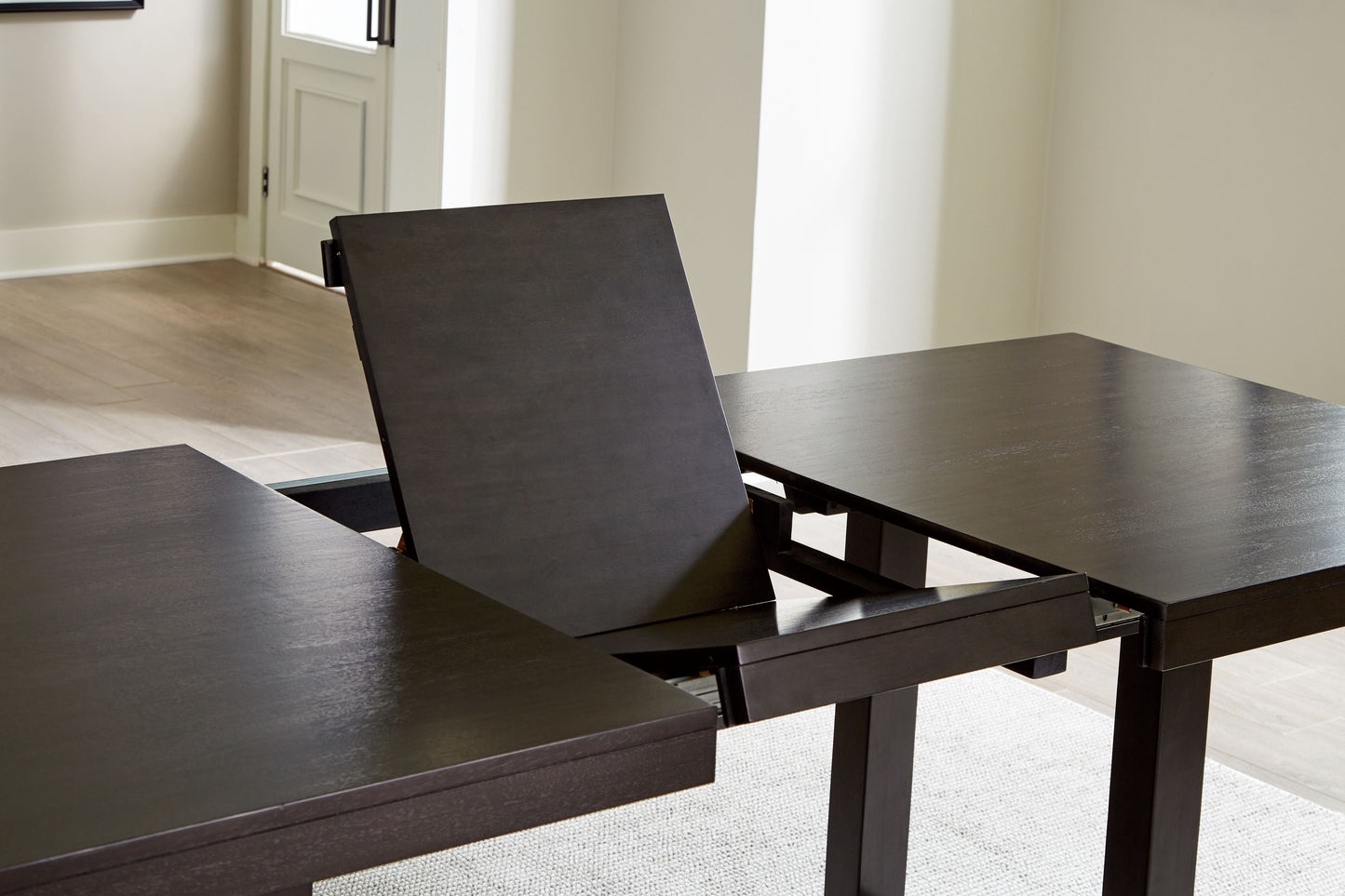 Neymorton - Rectangular Dining Room Butterfly Extension Table - Dark Grayish Brown