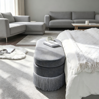 Oval Upholstered Storage Ottoman with Fringe Trim
