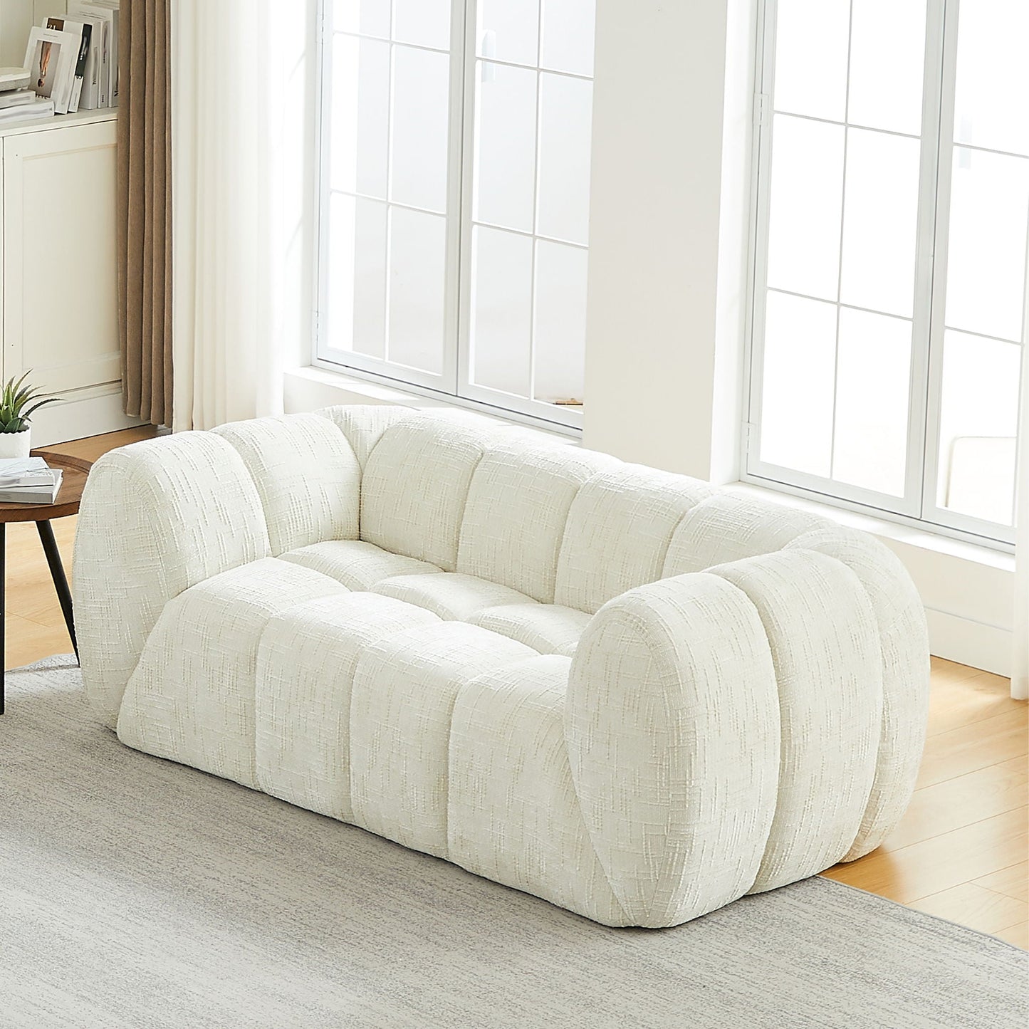 Quilted Cloud Sofa With Rounded Armrests And Piano Key Backrest Design
