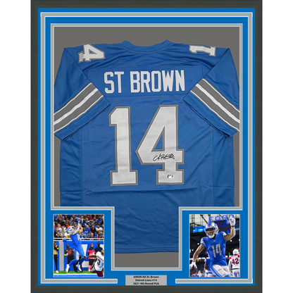 Framed Autographed/Signed Amon-Ra St. Brown 35x39 Detroit Current Blue Football Jersey Beckett BAS COA