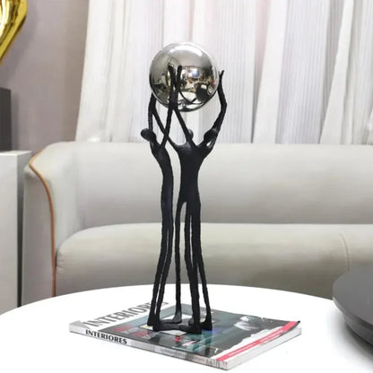 Black Iron Figure Sculpture with Silver Sphere