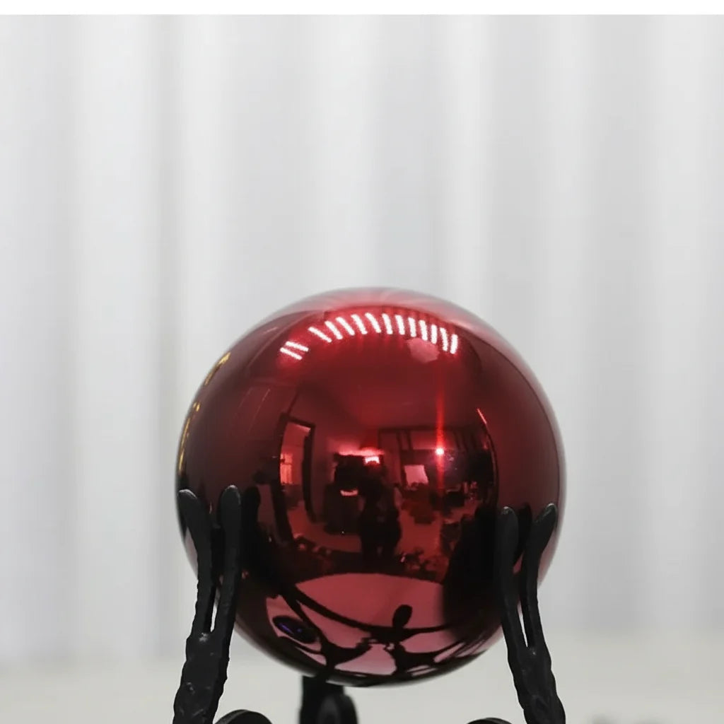 Black Iron Figure Sculpture with Silver Sphere