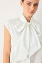 MODERN STATEMENT BOW WOVEN TOP