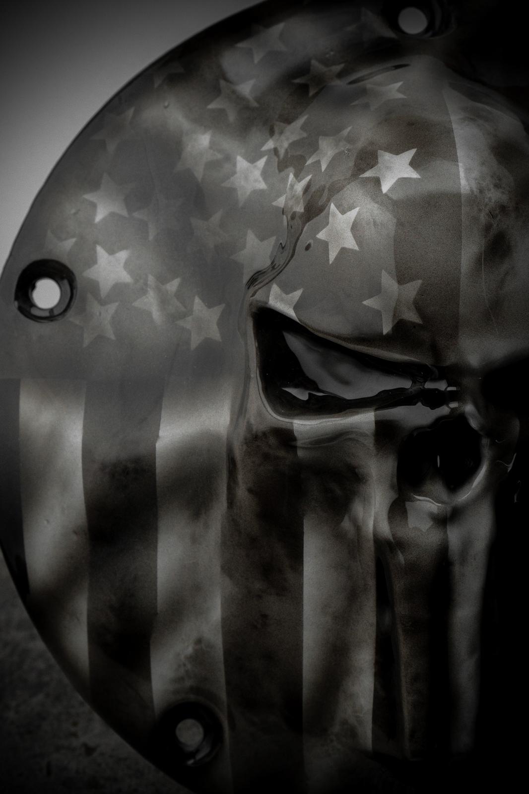 Punisher skull stretching through flag Harley derby and points cover
