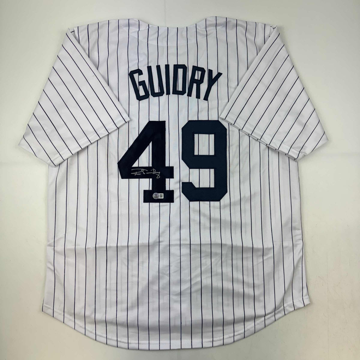 Autographed/Signed Ron Guidry New York Pinstripe Baseball Jersey Beckett BAS COA
