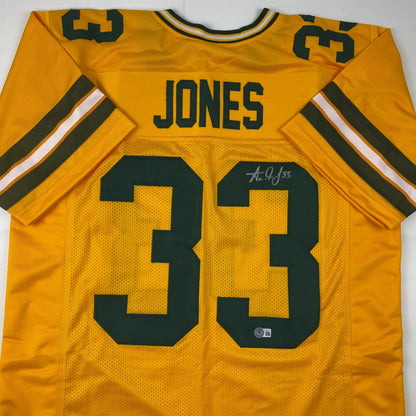 Autographed/Signed Aaron Jones Green Bay Yellow Football Jersey Beckett BAS COA
