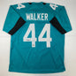 Autographed/Signed Travon Walker Jacksonville Teal Football Jersey Beckett BAS COA