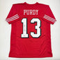Autographed/Signed Brock Purdy San Francisco Red Alternate Football Jersey Beckett BAS COA