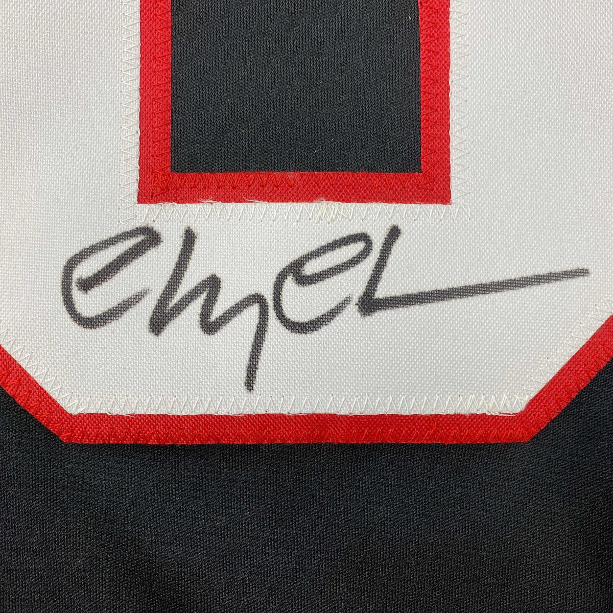 Autographed/Signed Chevy Chase Clark Griswold Christmas Vacation Movie Chicago Black Hockey Jersey Beckett BAS COA
