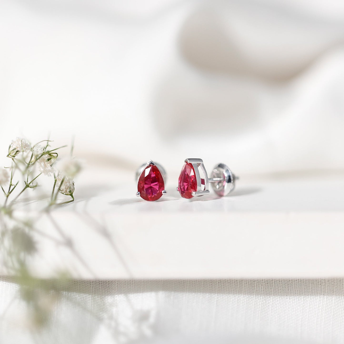 Solitaire 1.5 Carat Pear Shaped Lab Created Ruby Stud Earrings