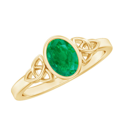 Oval Shaped Emerald Celtic Engagement Ring in Bezel Setting