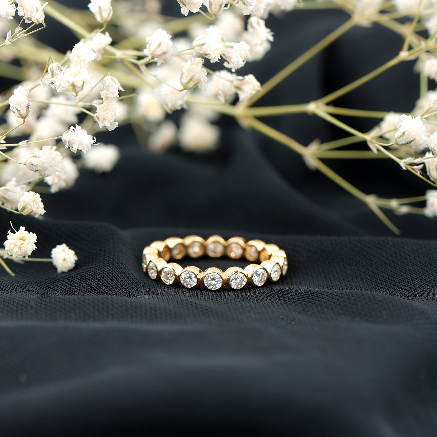 Bezel Set Moissanite Eternity Ring in Yellow Plated Silver