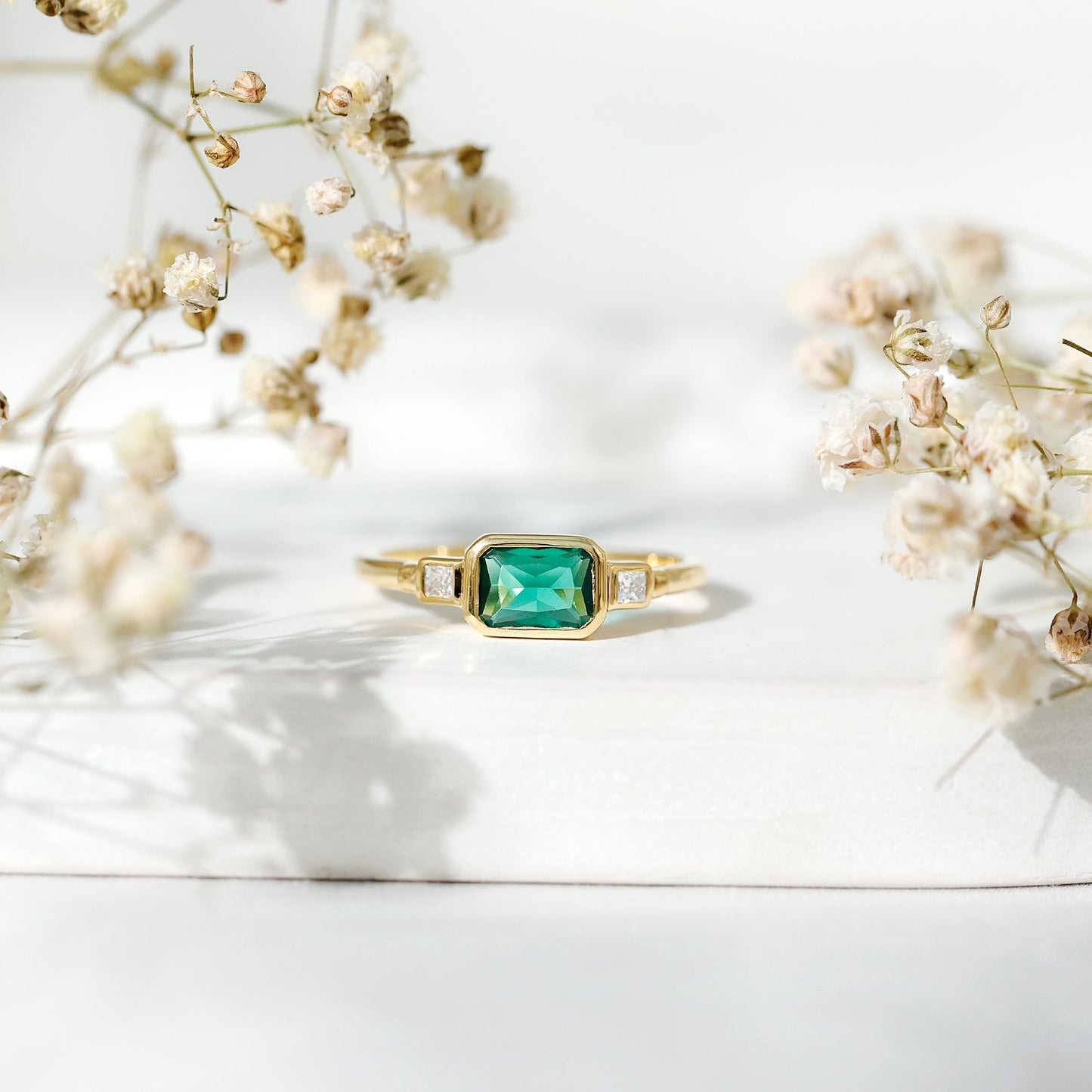 1 Carat Lab Grown Emerald 3 Stone Engagement Ring with Diamond in East West Style