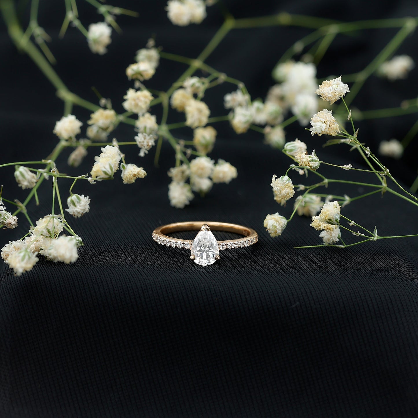 0.6 Carat Pear Cut Man Made Diamond Engagement Ring