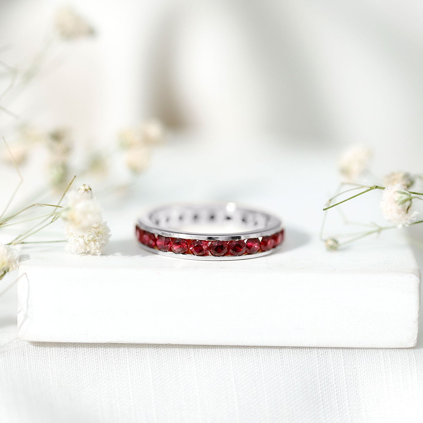 Round Created Ruby Full Eternity Ring in Channel Setting