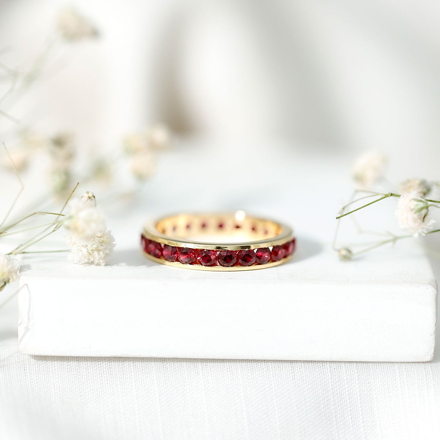 Round Created Ruby Full Eternity Ring in Channel Setting