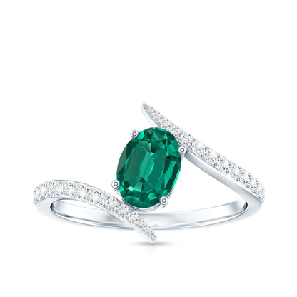 Oval Shaped 5X7 MM Lab Grown Emerald Bypass Engagement Ring