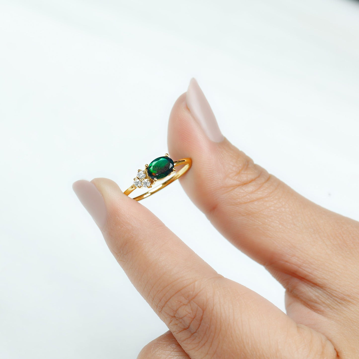 Oval Black Opal East West Ring with Diamond Trio