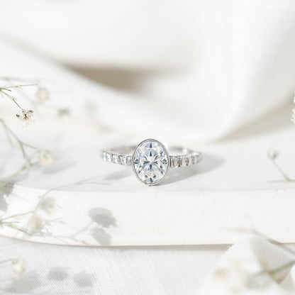 Bezel Set Moissanite Oval Engagement Ring with Side Stones