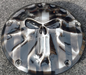 Punisher stretching through black and silver Flag Harley derby cover