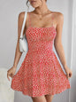 The cami dress with small flower prints a backless design and thin spaghetti straps is suitable for beach vacations and summer