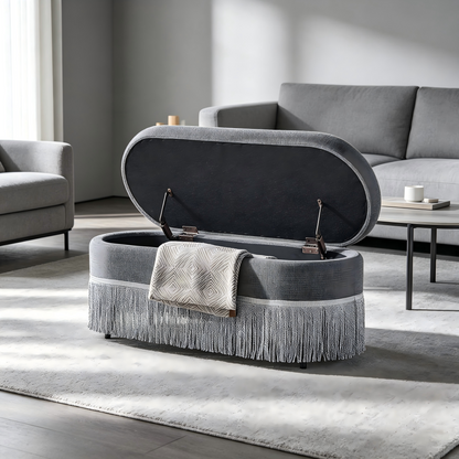 Oval Upholstered Storage Ottoman with Fringe Trim