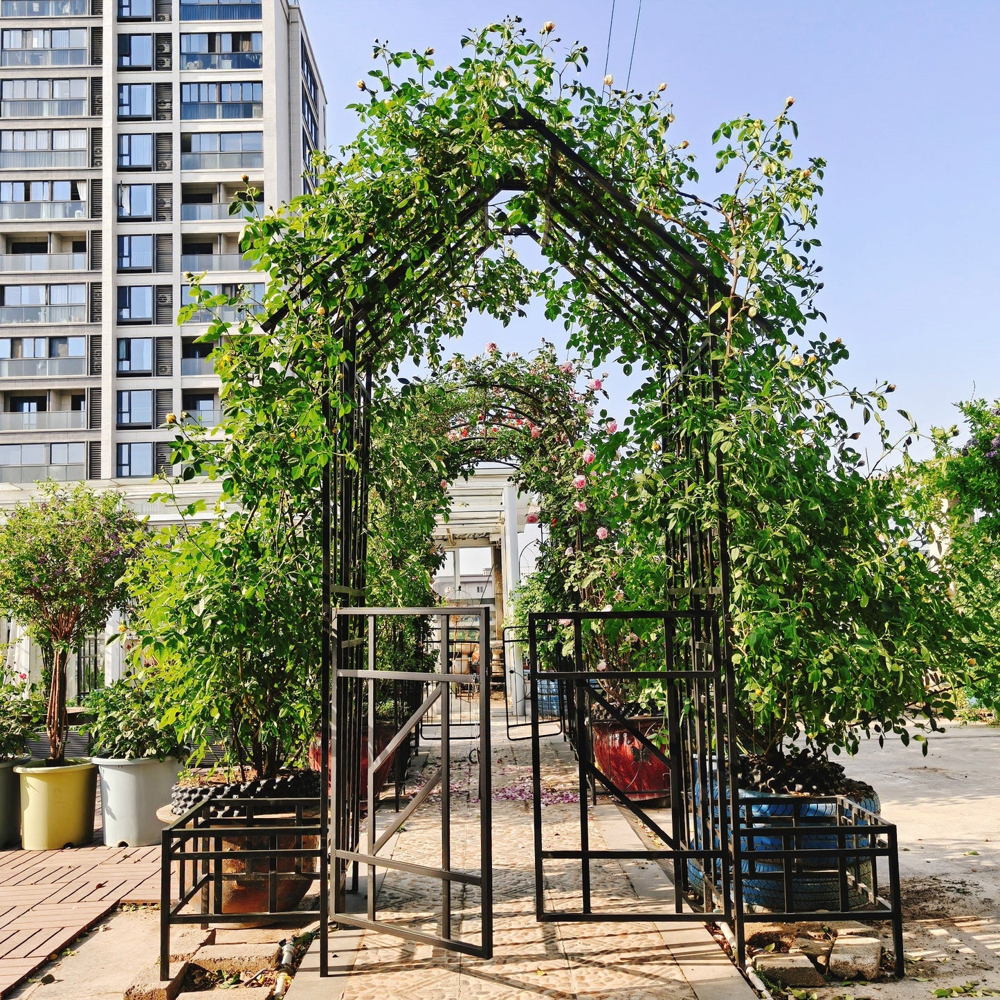 Metal Garden Arch with Gate and Planter for Climbing Plants