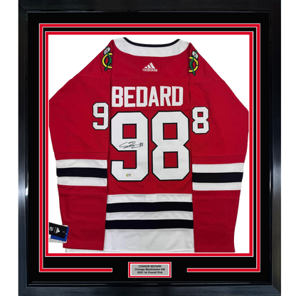 Framed Autographed/Signed Connor Bedard 35x39 Chicago Blackhawks Red Hockey Jersey PSA COA