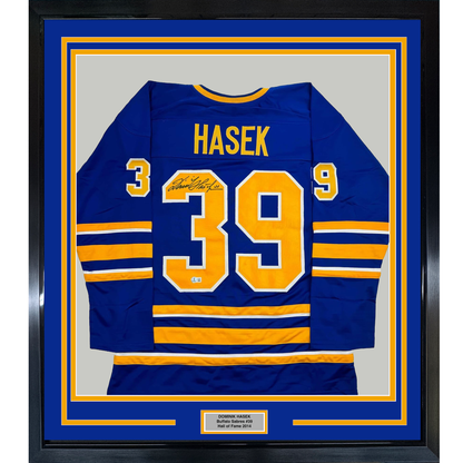 Framed Autographed/Signed Dominik Hasek 35x39 Buffalo Blue Hockey Jersey Beckett BAS COA