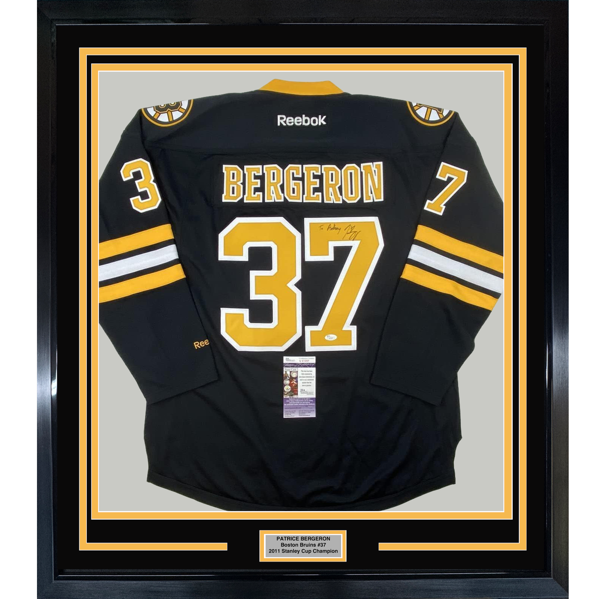 Framed Autographed/Signed Patrice 35x39 Bergeron Personalized To Anthony Boston Bruins Black Hockey Jersey JSA COA
