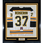 Framed Autographed/Signed Patrice Bergeron 35x39 Boston White Hockey Jersey JSA COA