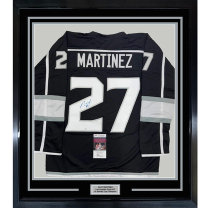 Framed Autographed/Signed Alec Martinez 35x39 Los Angeles LA Black Hockey Jersey JSA COA
